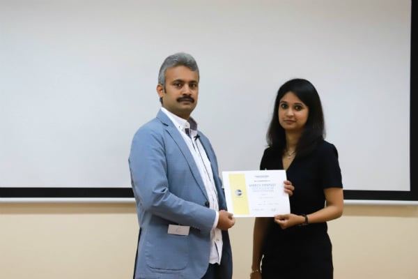 AB Lakshmanan (EMBA Alumni - Batch 39) was presented a certificate of participation by veteran Toastmasters TM Anitha