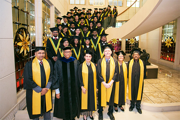 Our postgraduate students and faculty at the graduation ceremony earlier this year